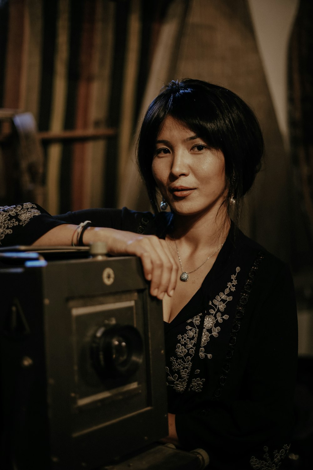 a woman holding a camera in her hands