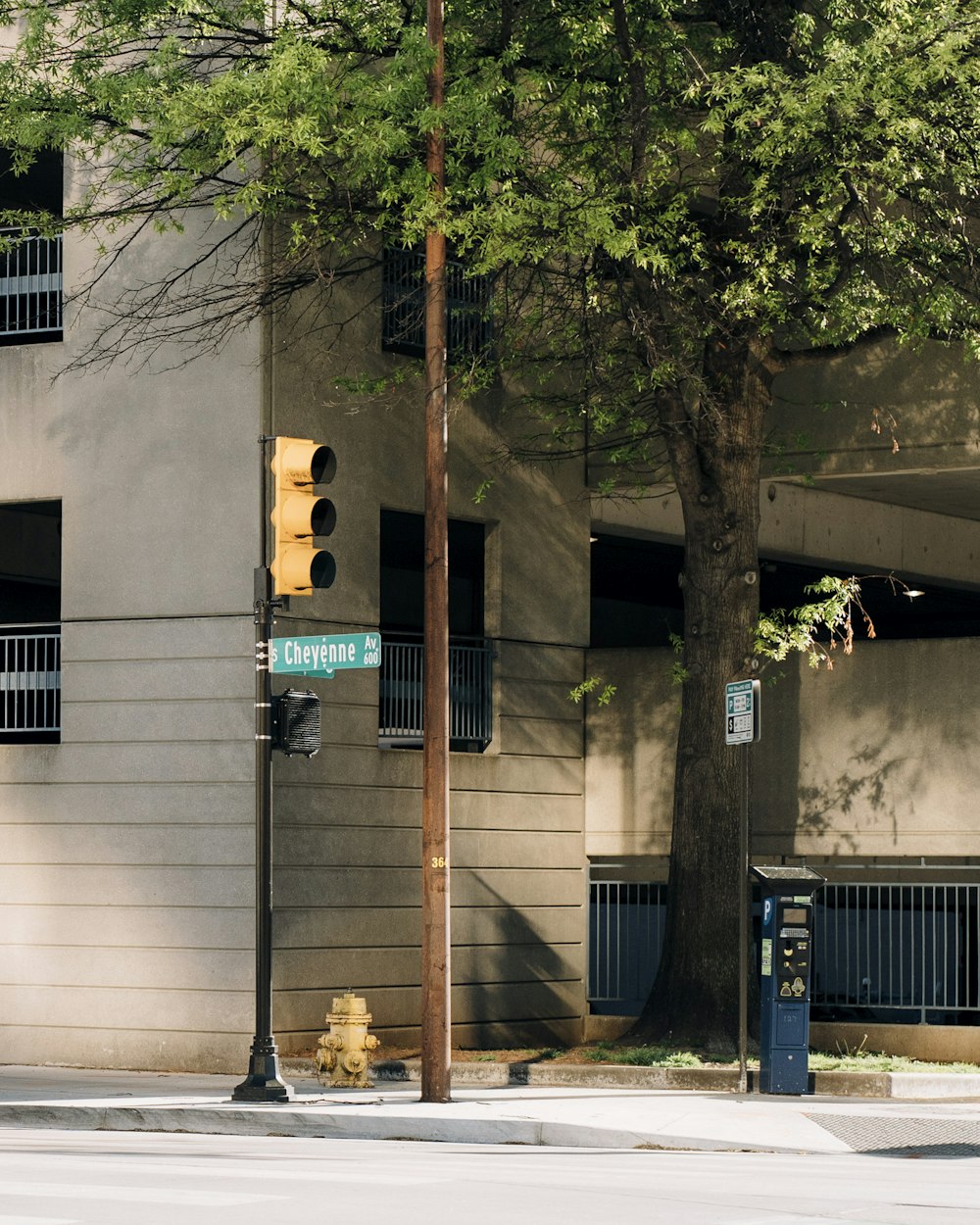 a traffic light sitting next to a tall building