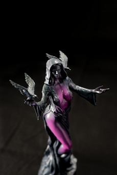 a statue of a woman with a bird in her hand