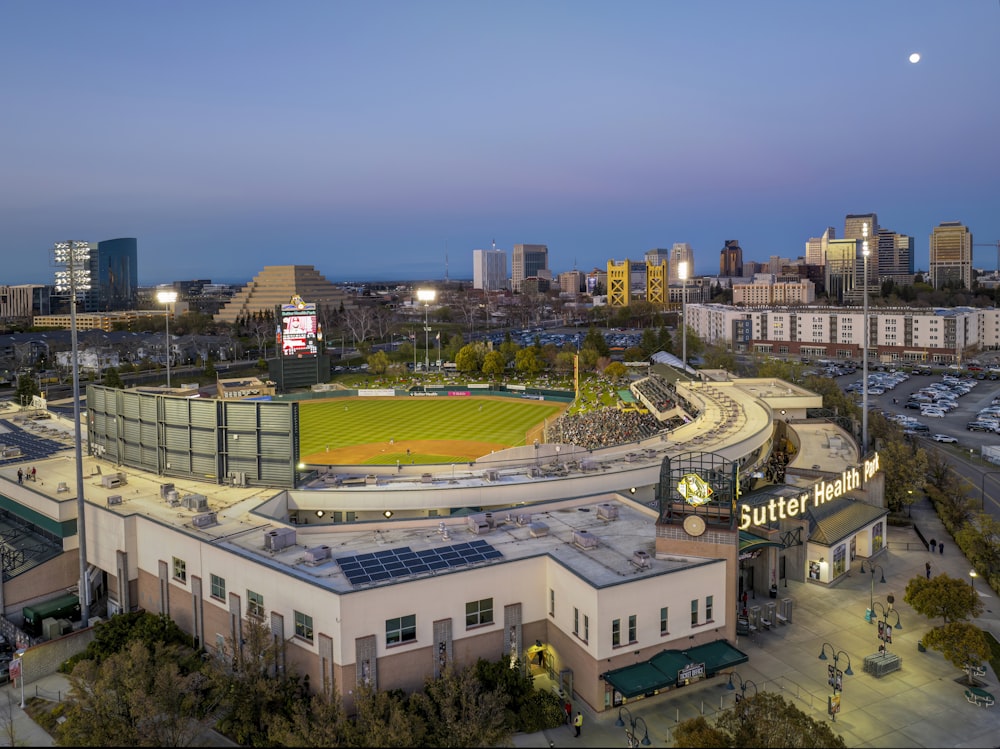 a baseball stadium with a full moon in the background