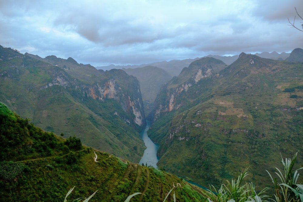 a valley with a river in the middle of it