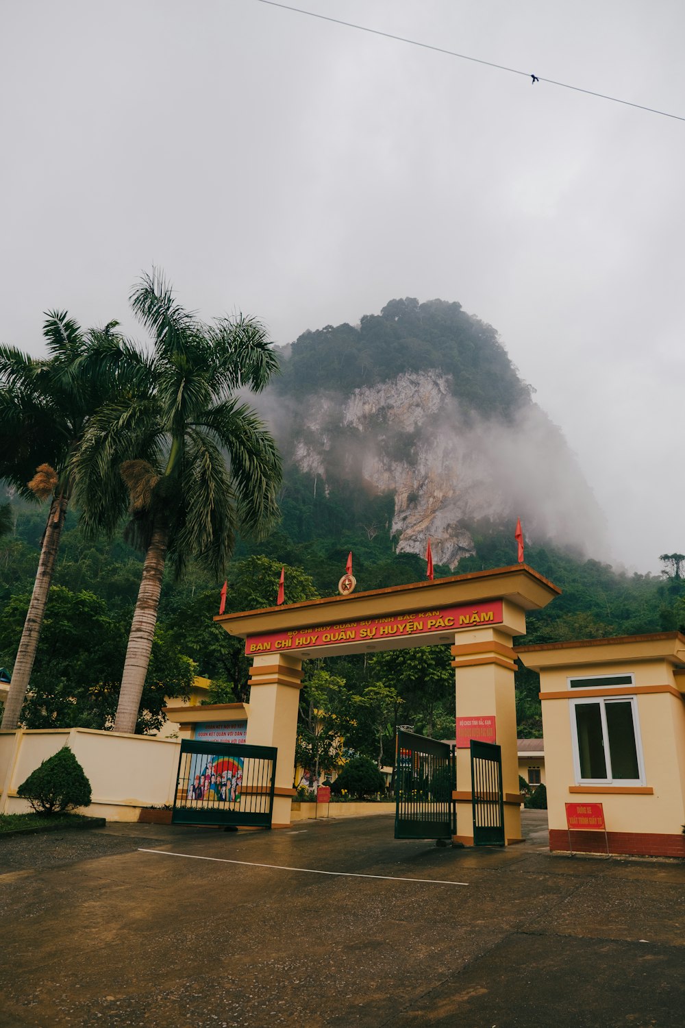 a gate with a mountain in the background