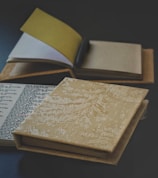 a stack of books sitting on top of a table