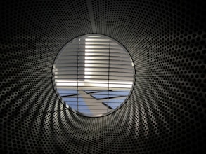 an airplane is seen through a circular window