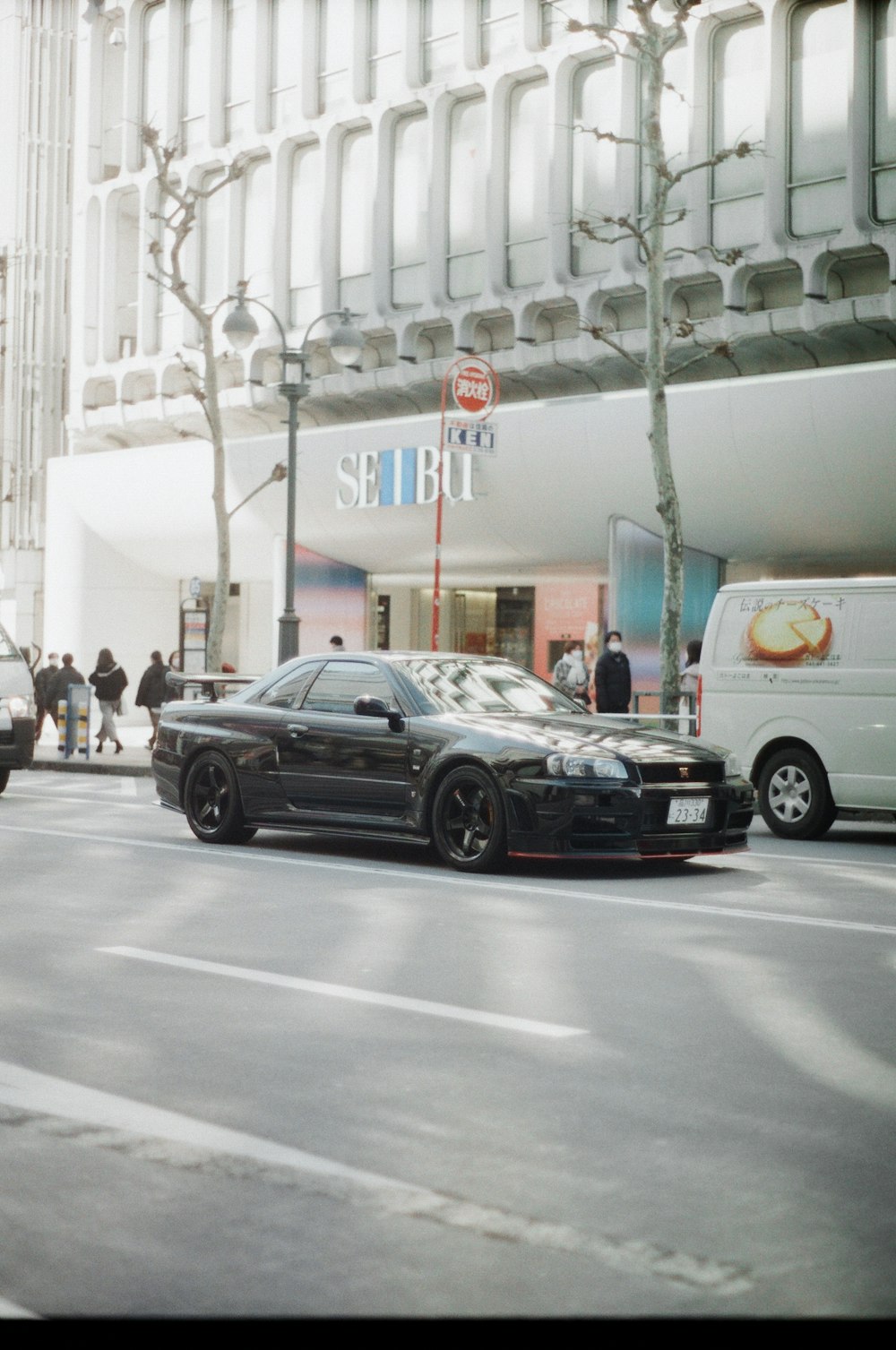 a couple of cars that are sitting in the street