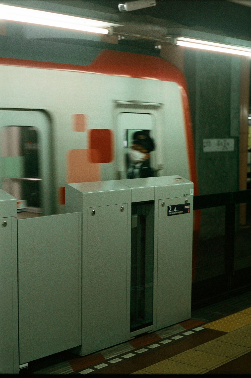 a subway train is moving through the station