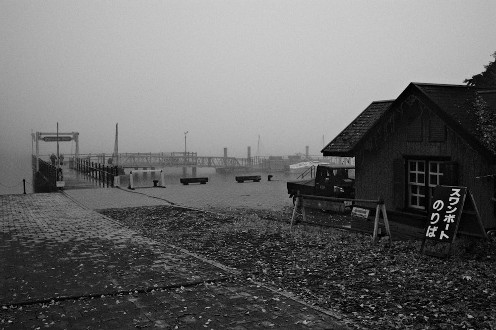 a black and white photo of a boat dock