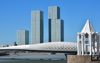 a large white structure sitting in the middle of a body of water