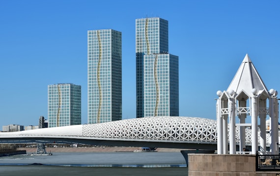 a large white structure sitting in the middle of a body of water