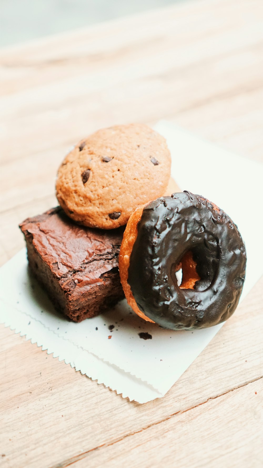 a couple of doughnuts sitting on top of a napkin