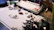 A cozy workspace with hands assembling a mechanical 3D puzzle, surrounded by elegant tools and pieces.
