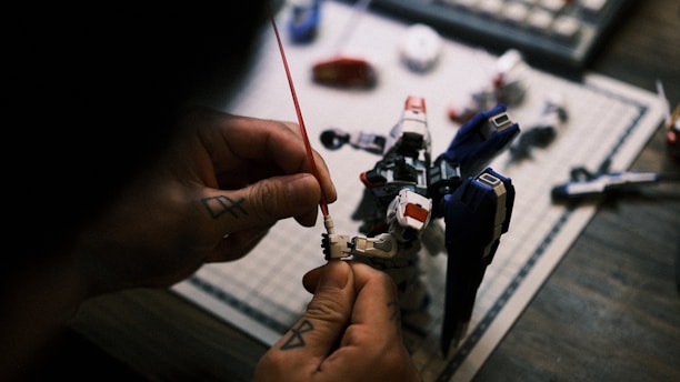 A close-up of a robot being assembled with various tools and components.