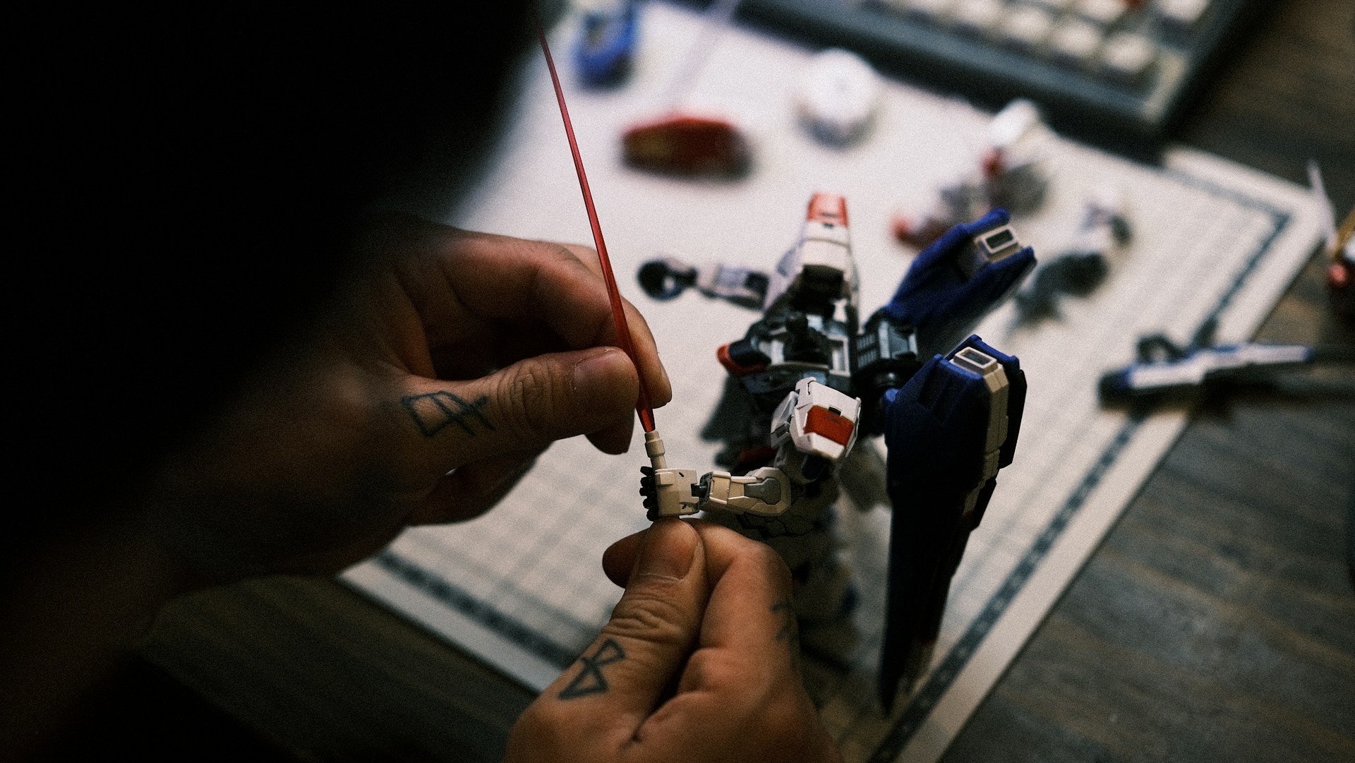 Photo of the Raider Robotics team proudly assembling their robot, surrounded by blue and gold tools and parts.