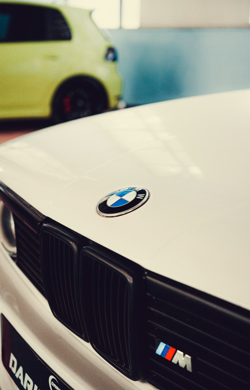 a close up of the front of a white bmw car