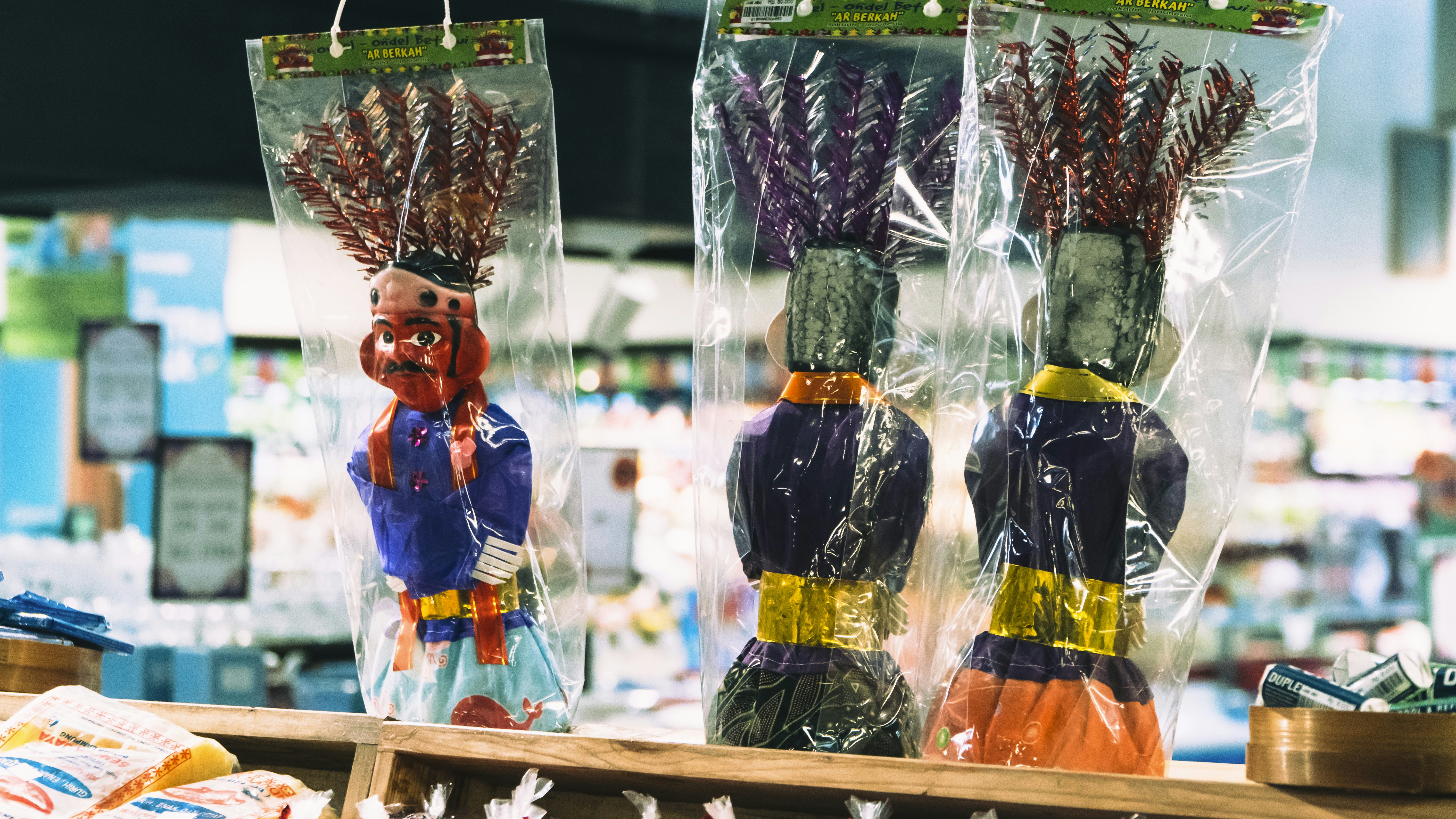 a couple of bags of dried flowers sitting on top of a table, 