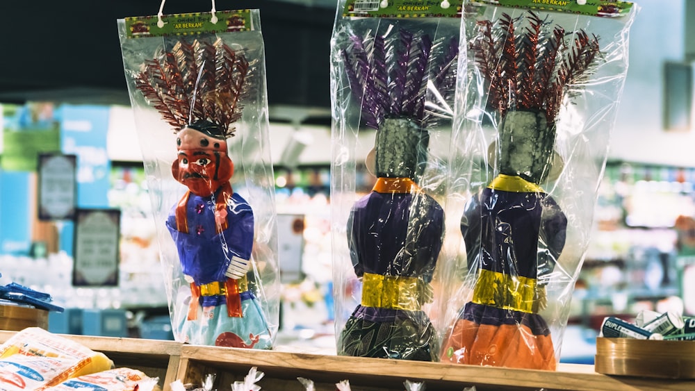 a couple of bags of dried flowers sitting on top of a table