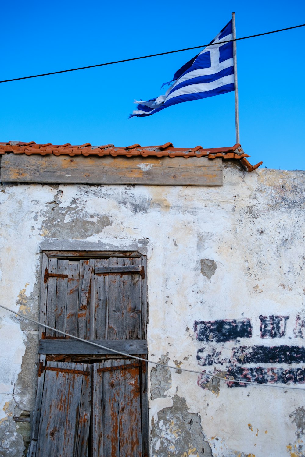 an old building with a flag on top of it