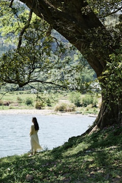 A serene image of a woman enjoying nature, symbolizing wellness.