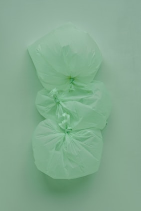 Black and white plastic trash bags neatly stacked