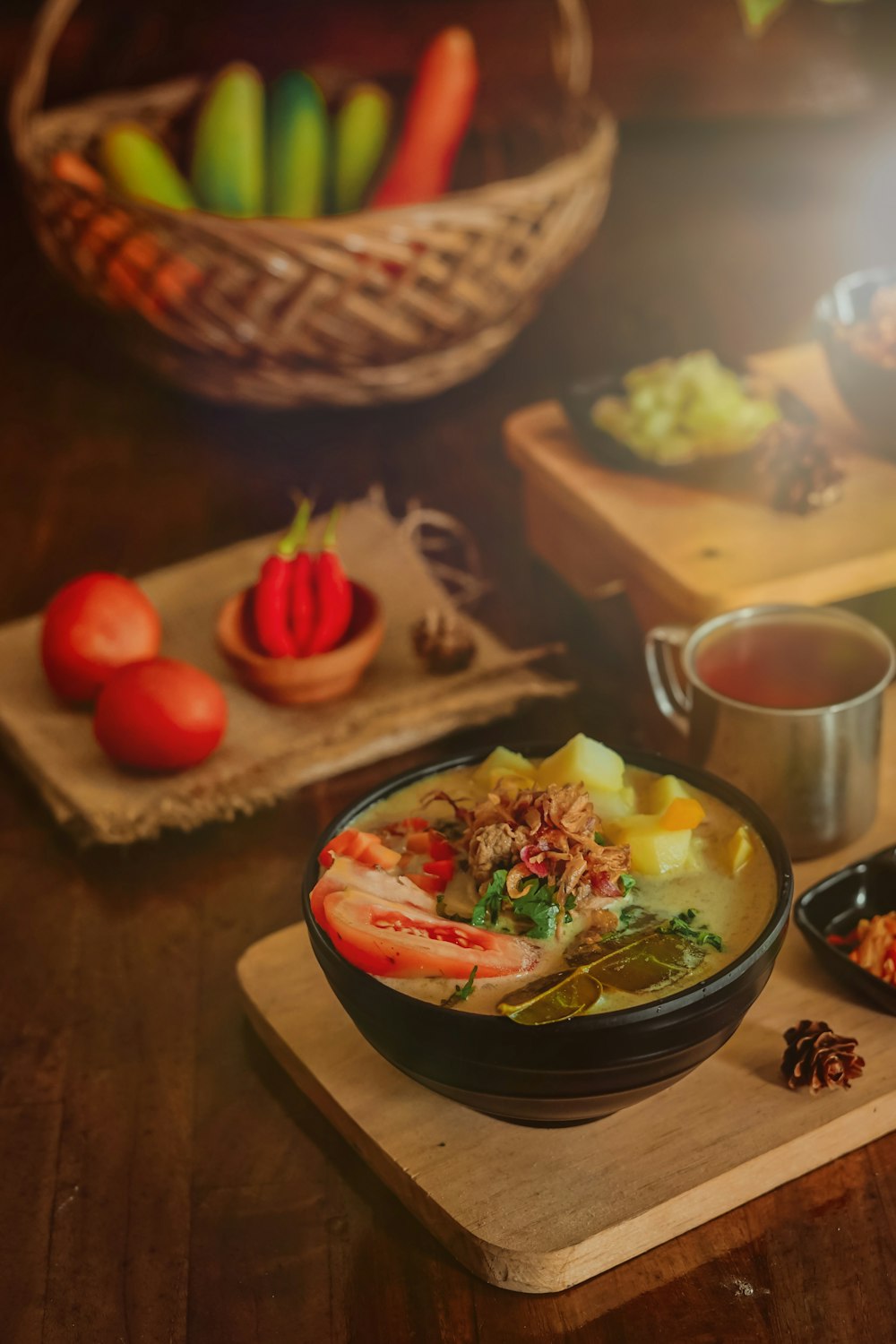 a wooden cutting board topped with a bowl of food