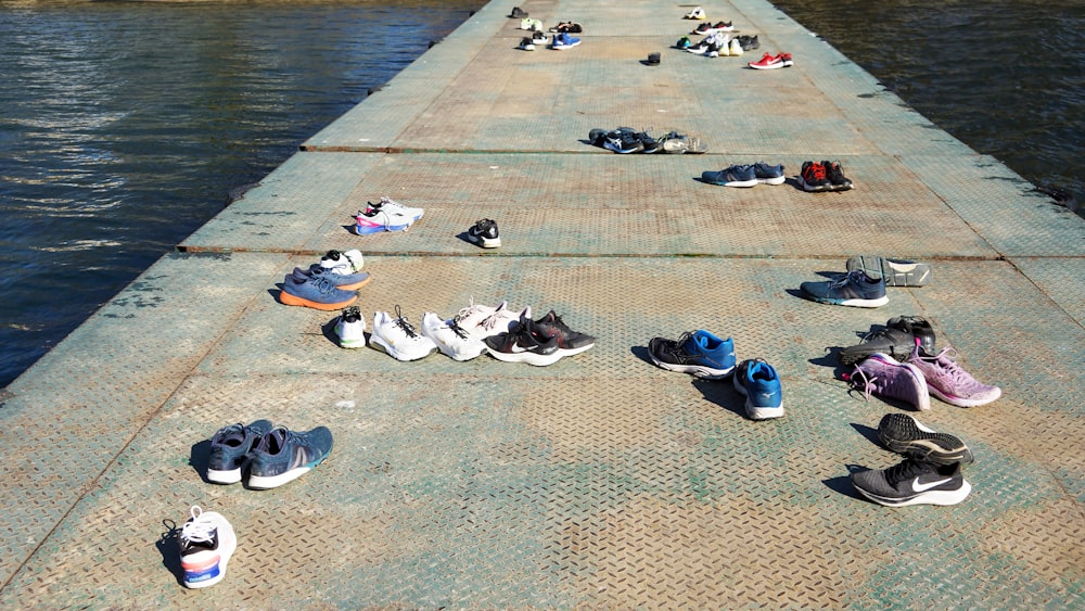a group of shoes that are sitting on a pier