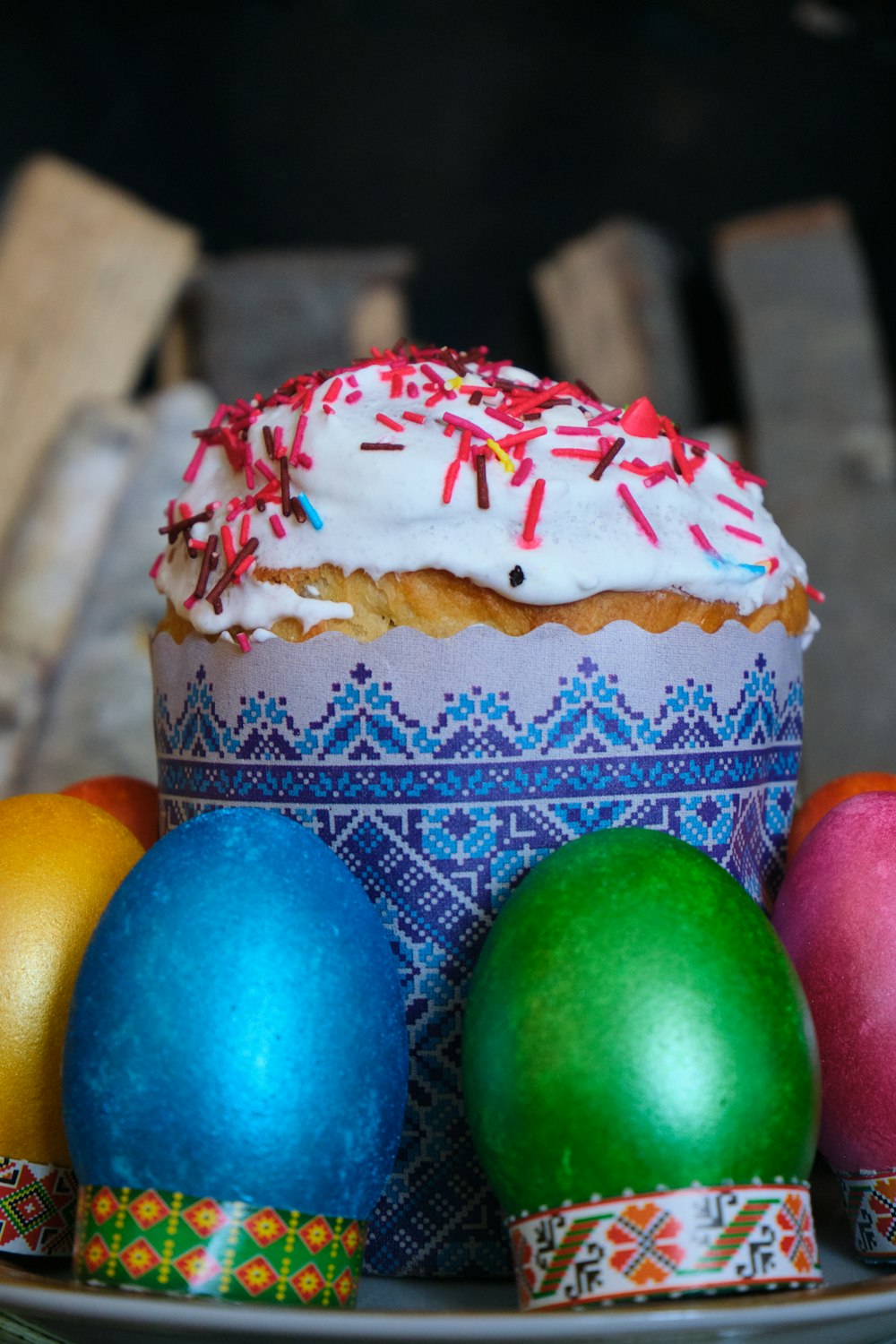 a cupcake with frosting and sprinkles on a plate