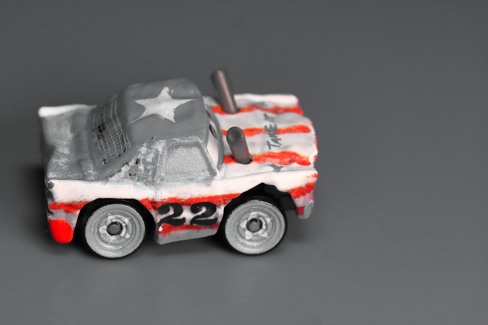 a toy car with a flag painted on it