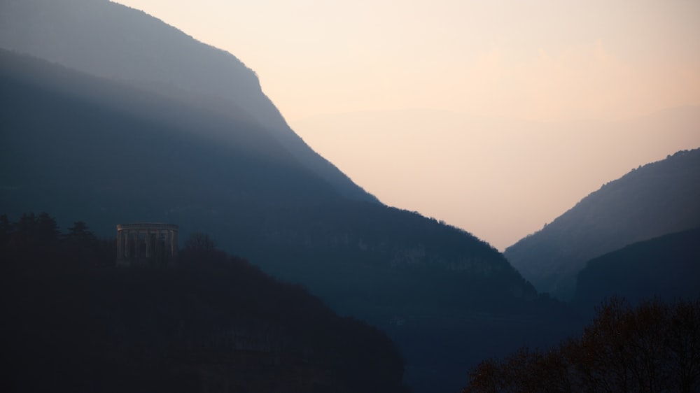 a view of a valley with mountains in the background