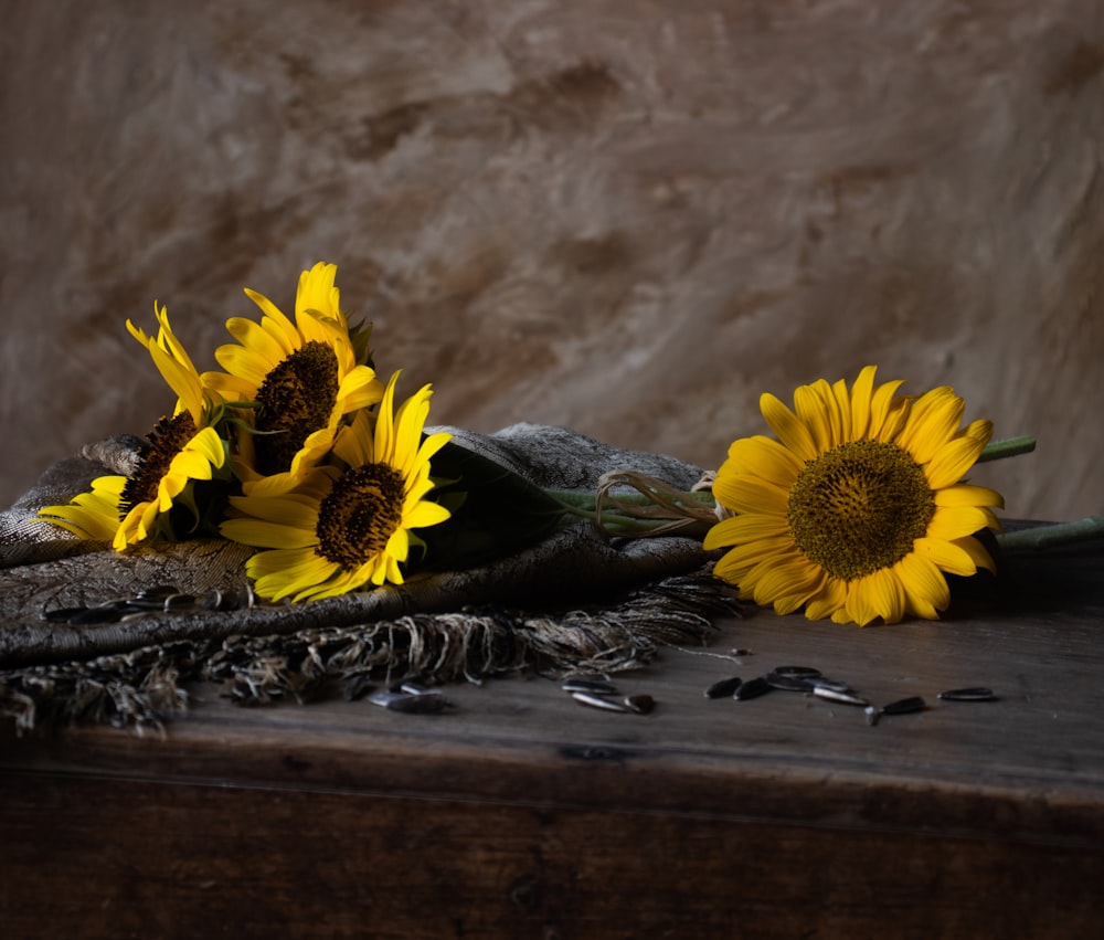 a bunch of sunflowers sitting on top of a table