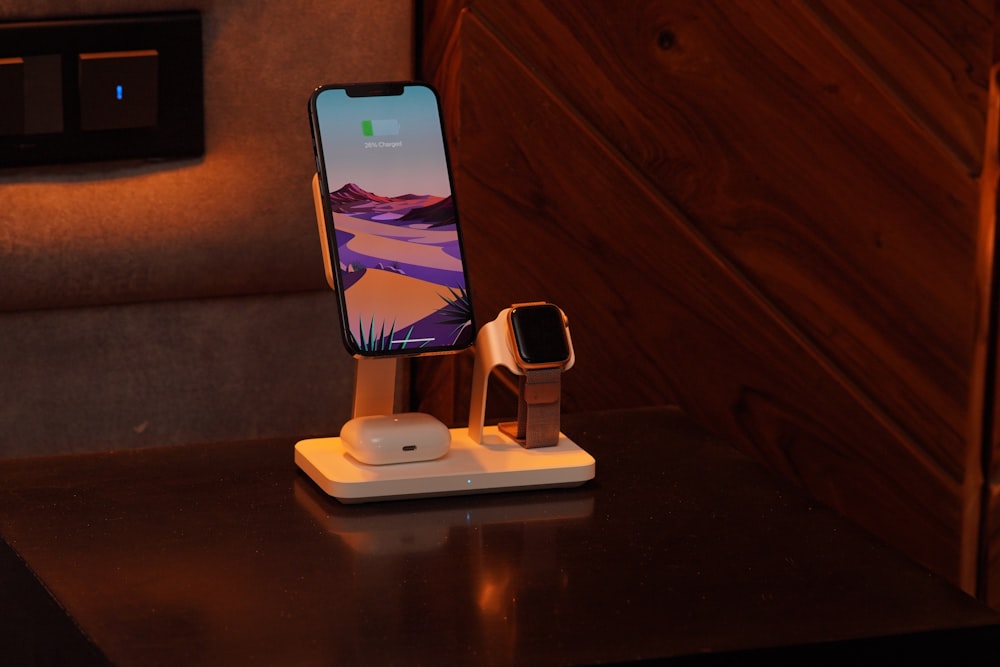 a cell phone and a charger on a table
