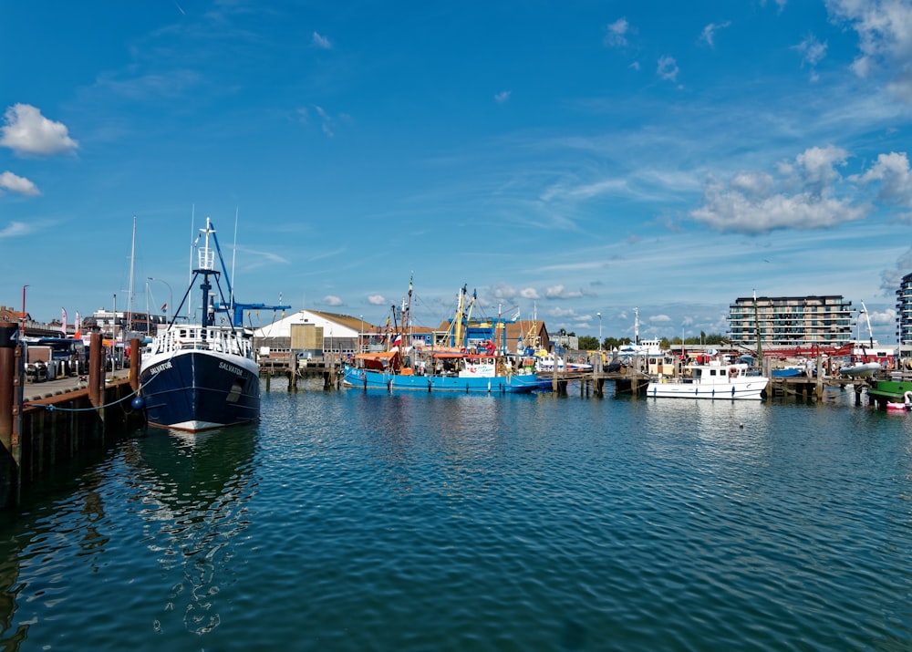 a harbor filled with lots of boats under a blue sky