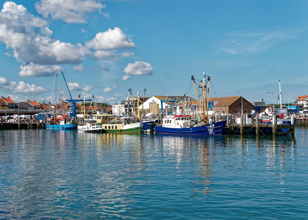 a group of boats that are sitting in the water