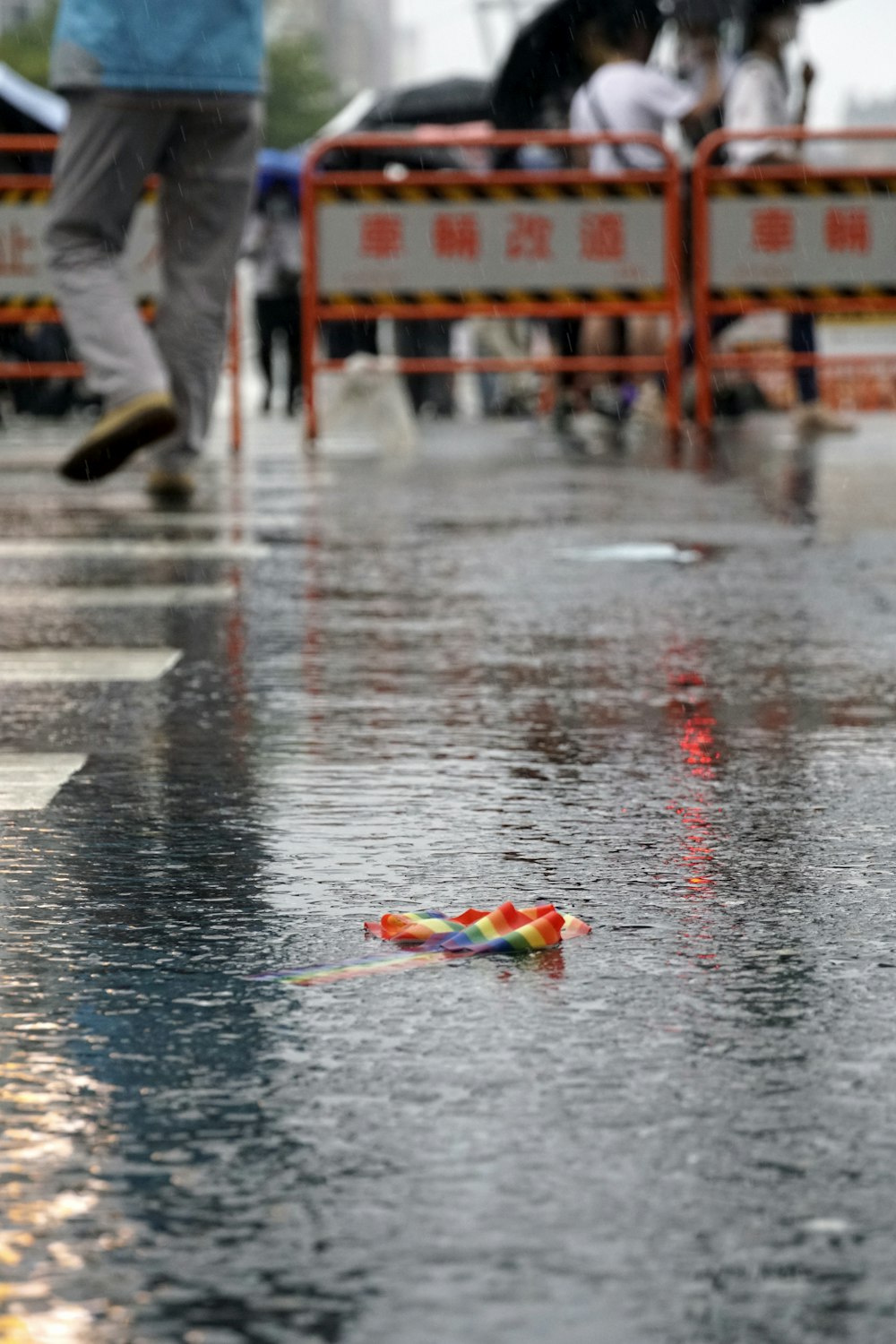 a street scene with focus on a toy on the ground