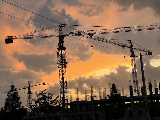 A sunset view of a construction project in progress.