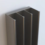 A modern 3D printed organizer with clean lines and a graphite gray finish on a dark background.