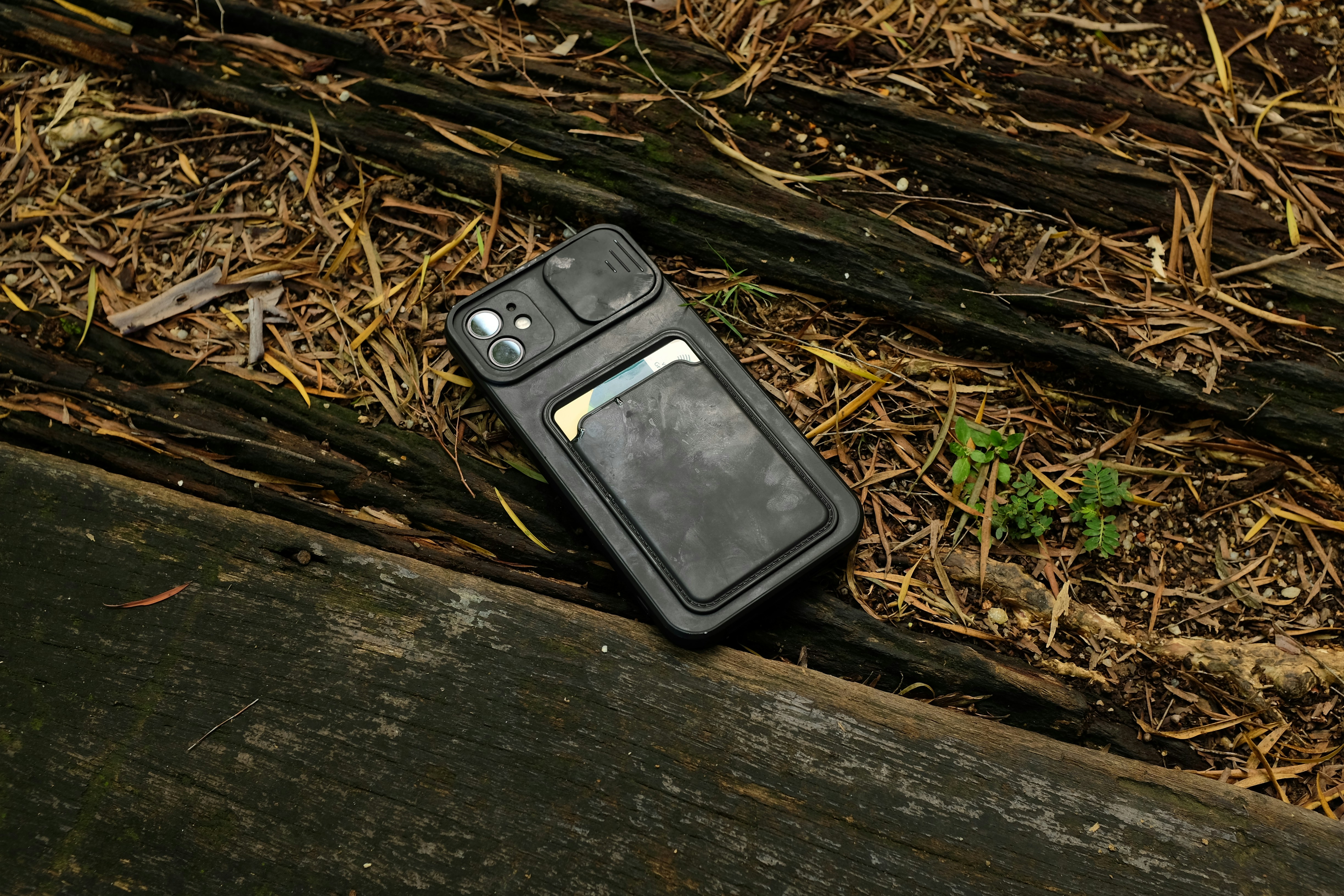 an old cell phone laying on the ground