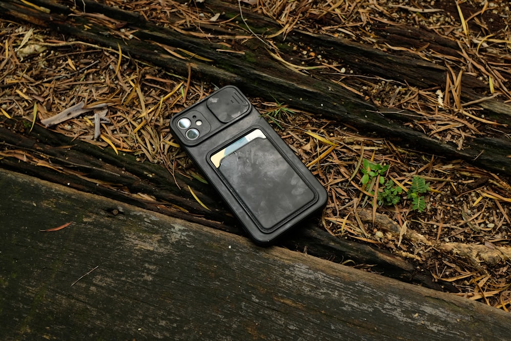 an old cell phone laying on the ground