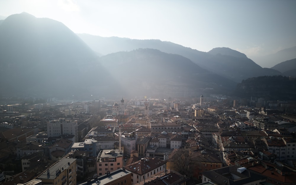 a view of a city with mountains in the background