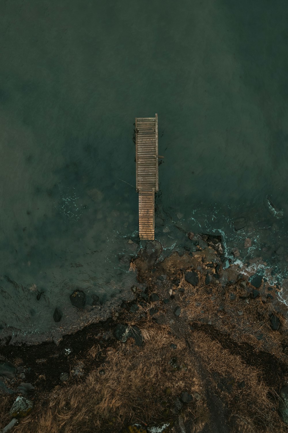 a dock in the middle of a body of water