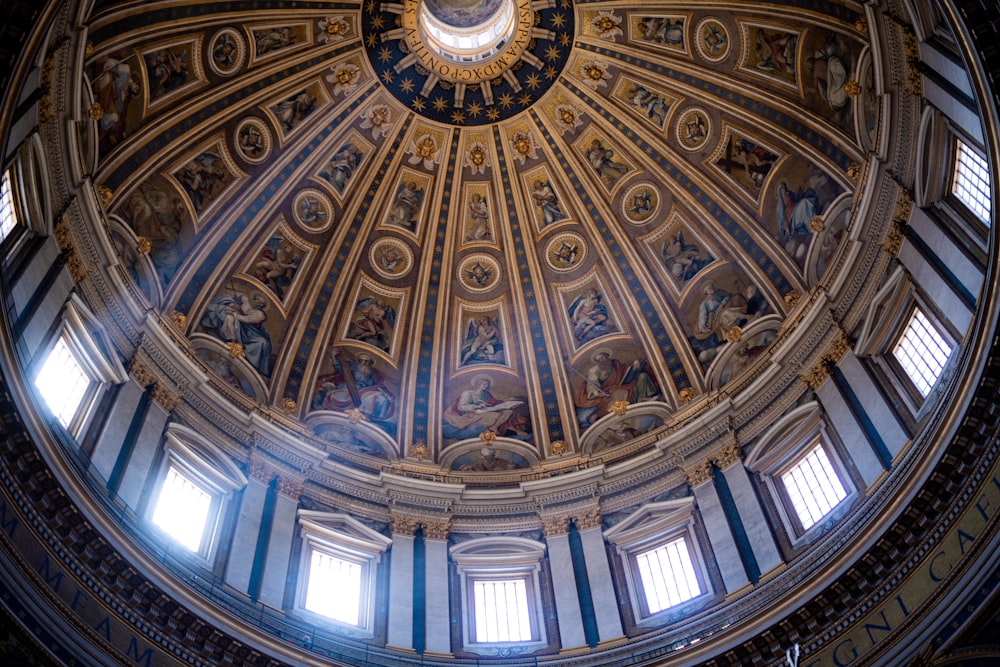 the dome of a building with paintings on it
