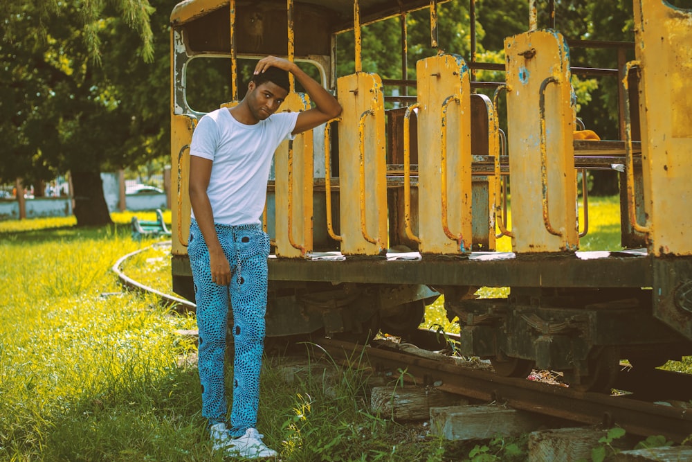 a man standing in front of a train car