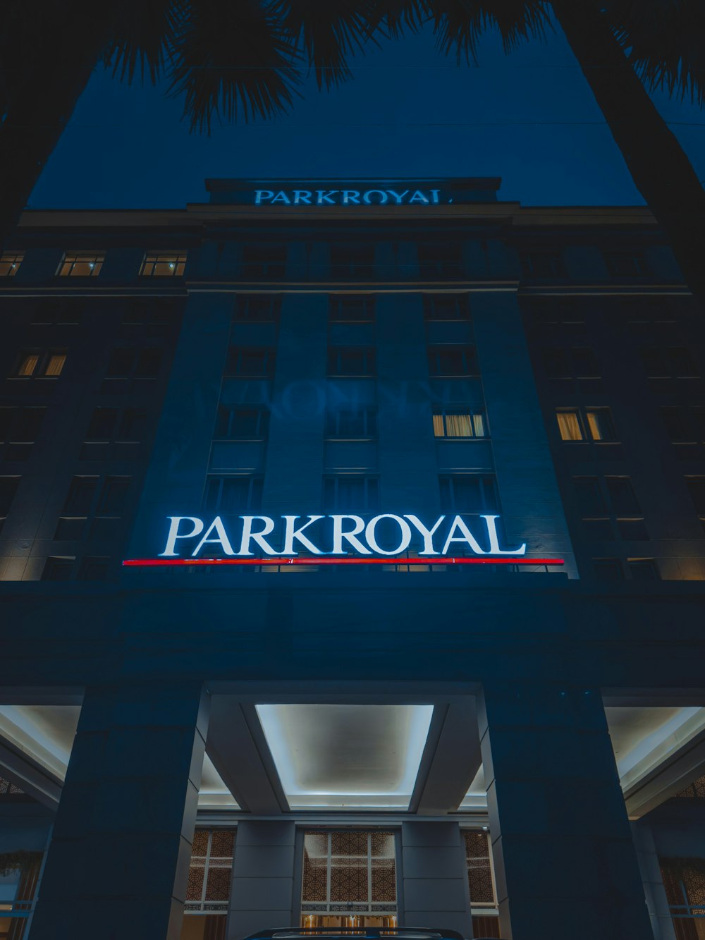 a car is parked in front of the park royal hotel