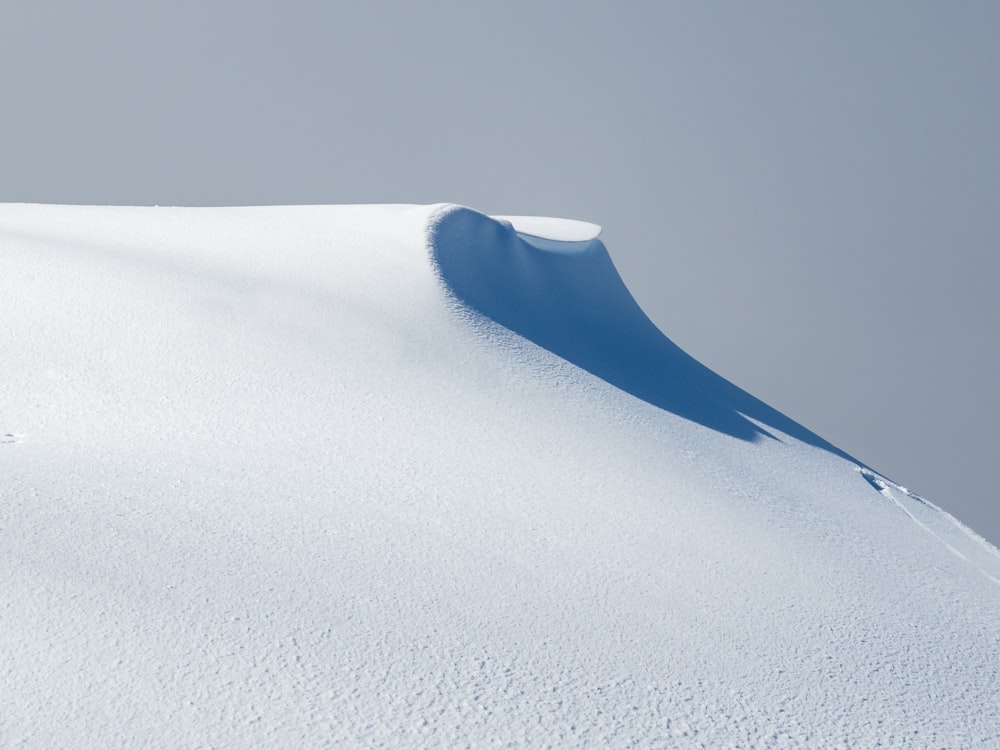 a person skiing down a snow covered hill