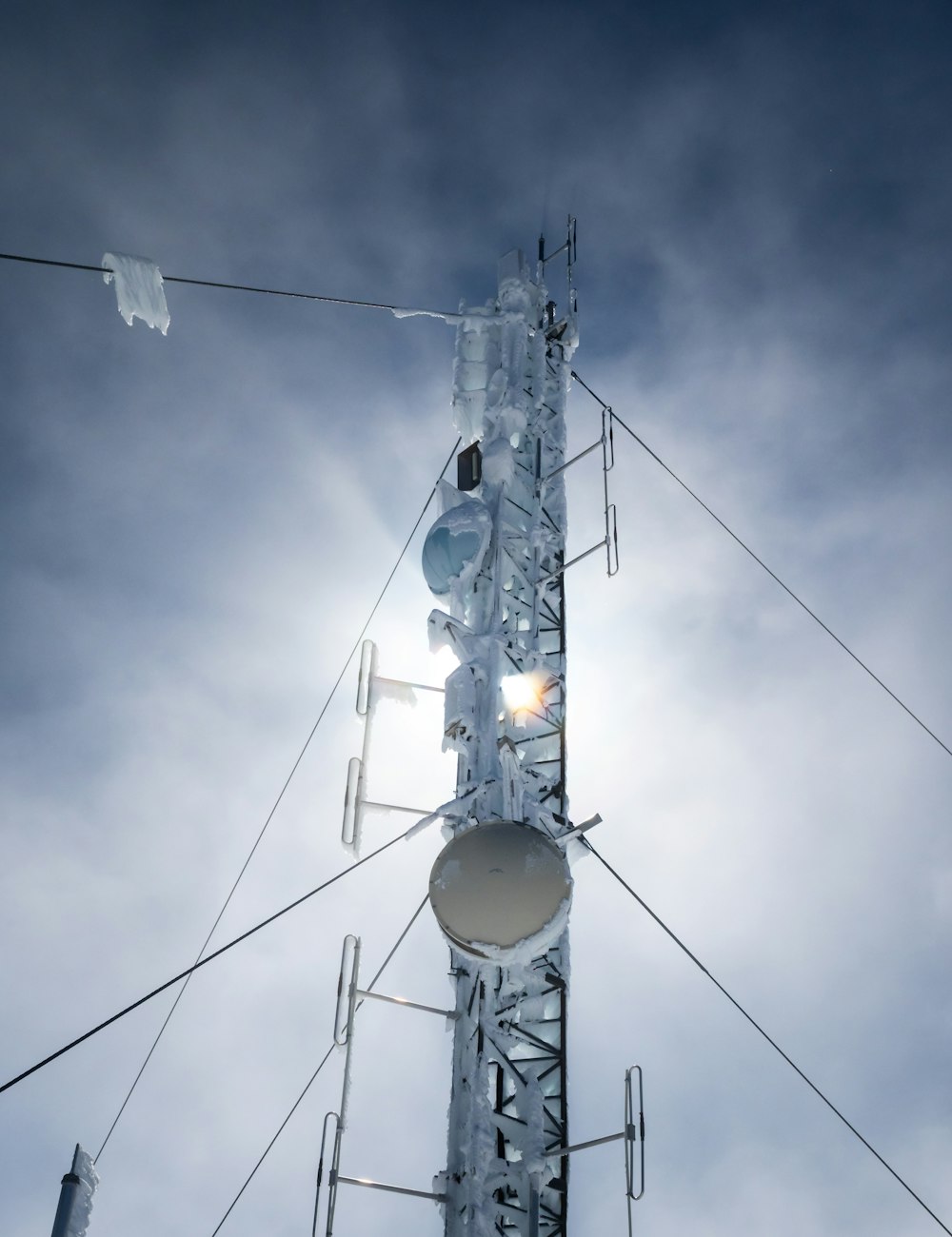 a cell phone tower with a sky background