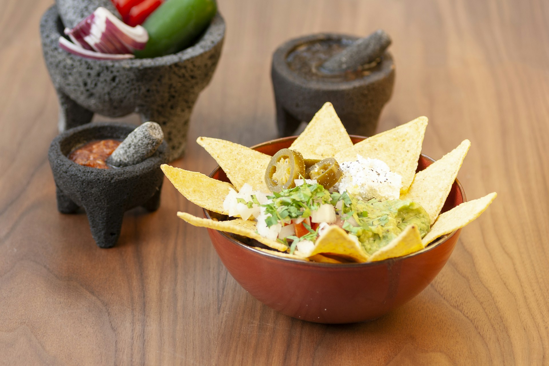 a bowl of nachos with salsa and tortilla chips