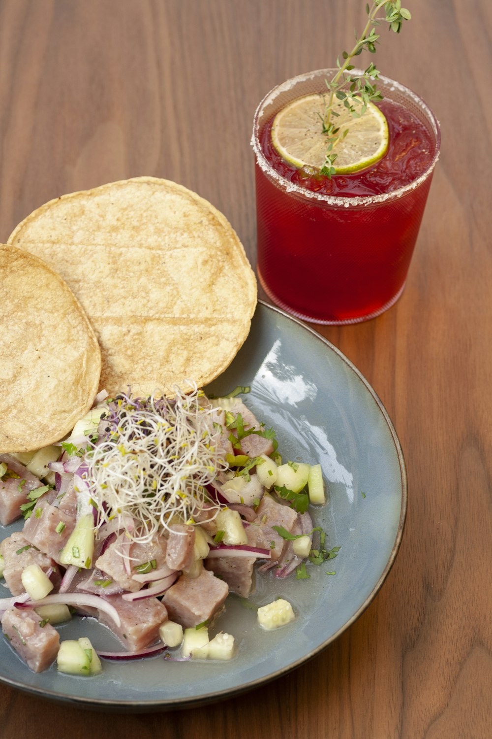 a plate of food and a drink on a table