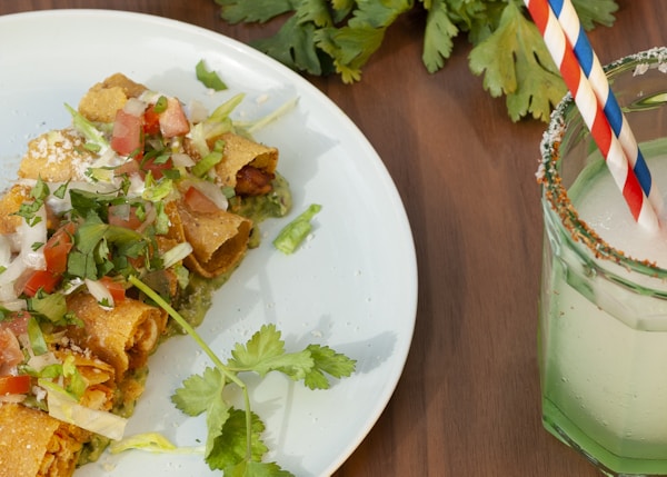 a plate of food and a drink on a table