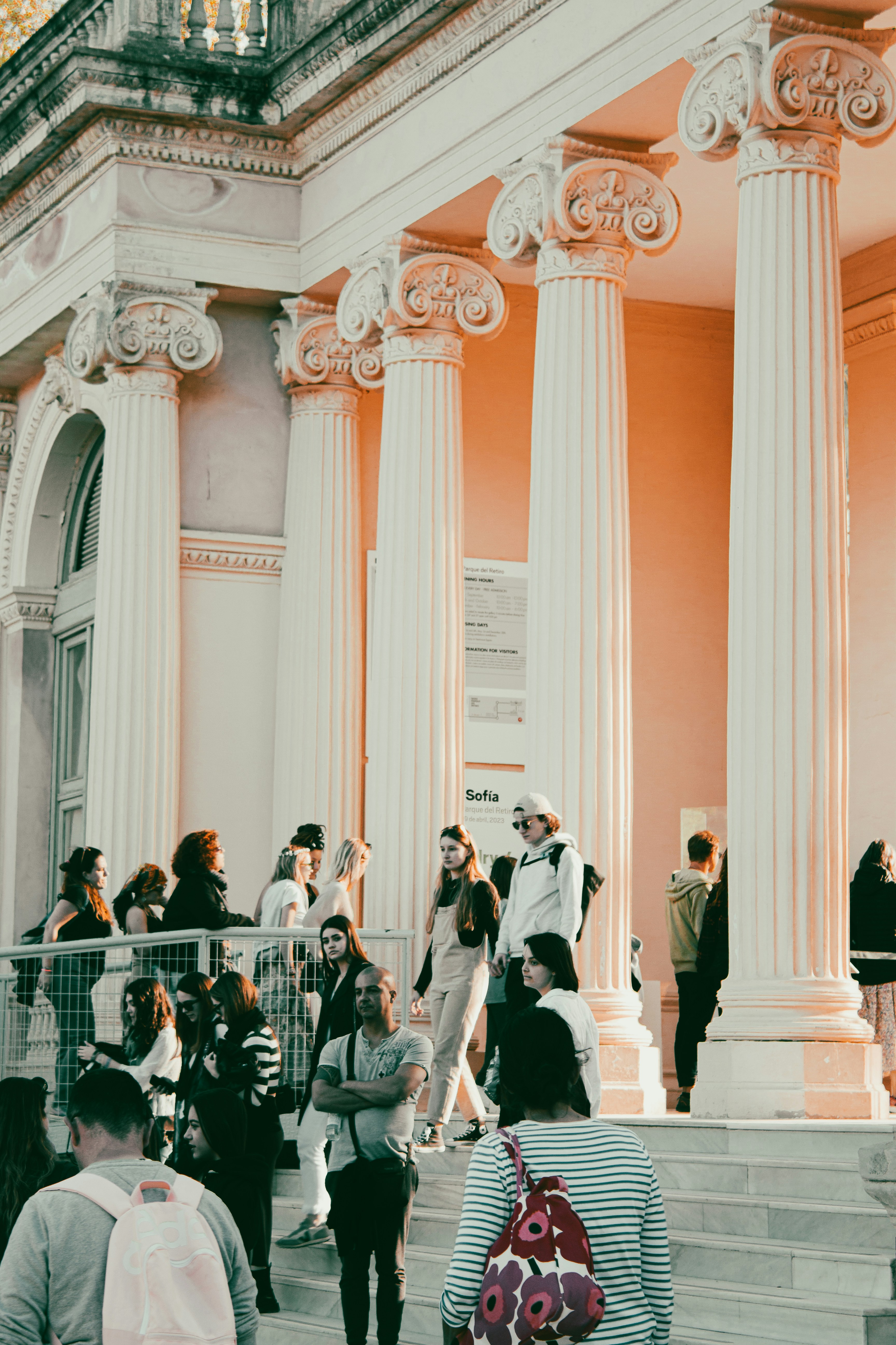 a group of people standing around a building