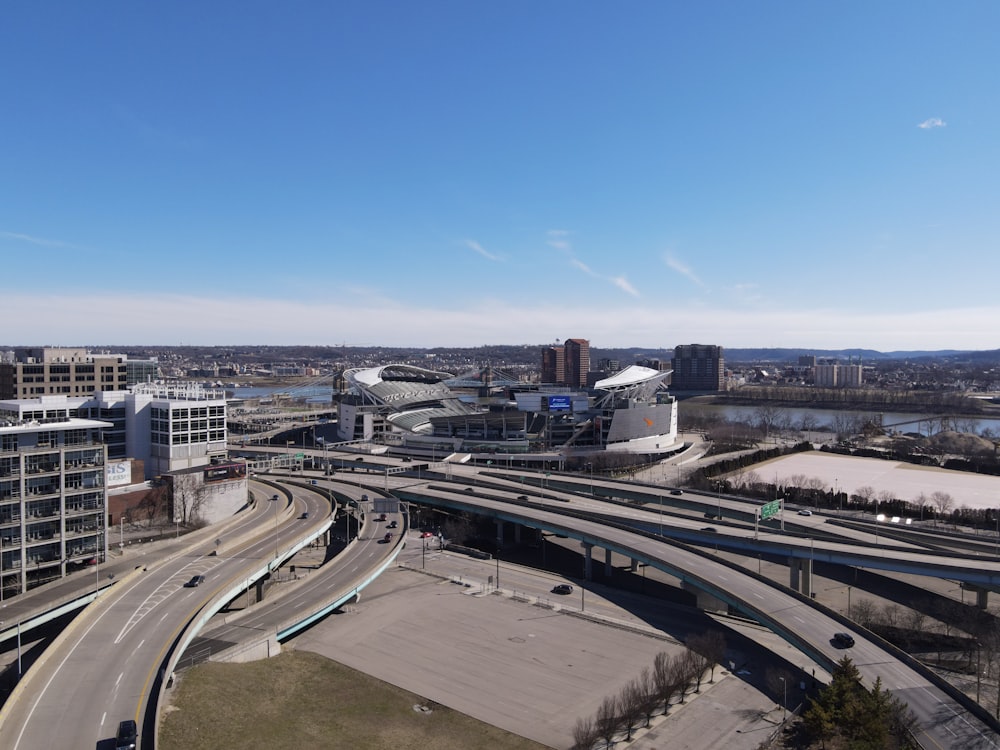 an aerial view of a highway with a bridge in the background