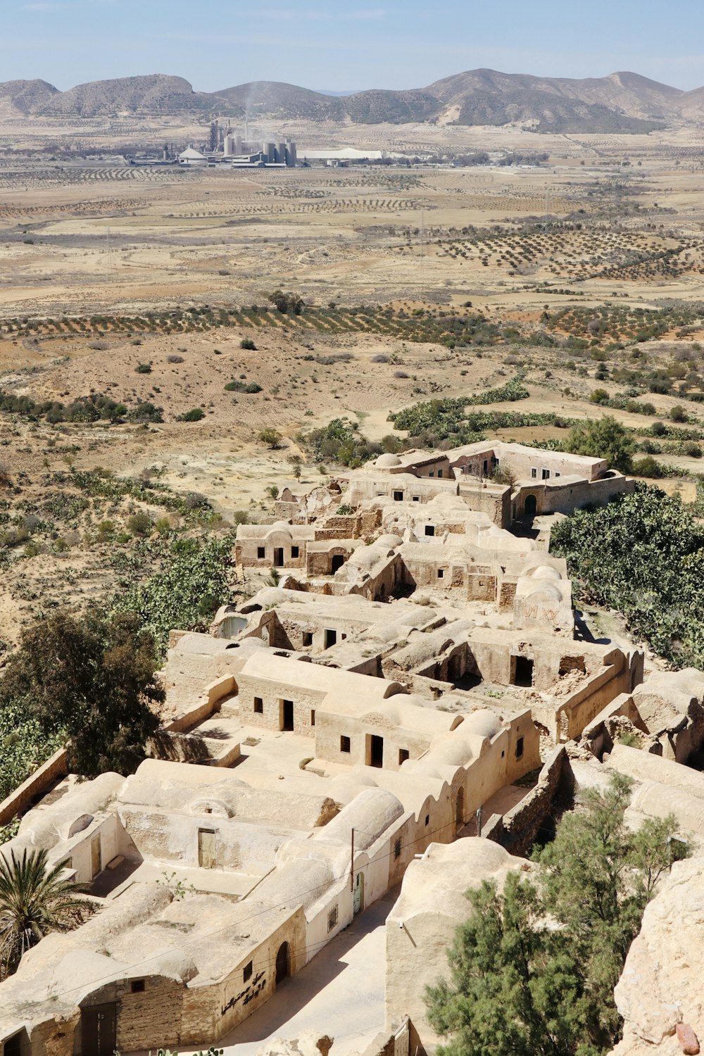 a view of a village in the middle of the desert